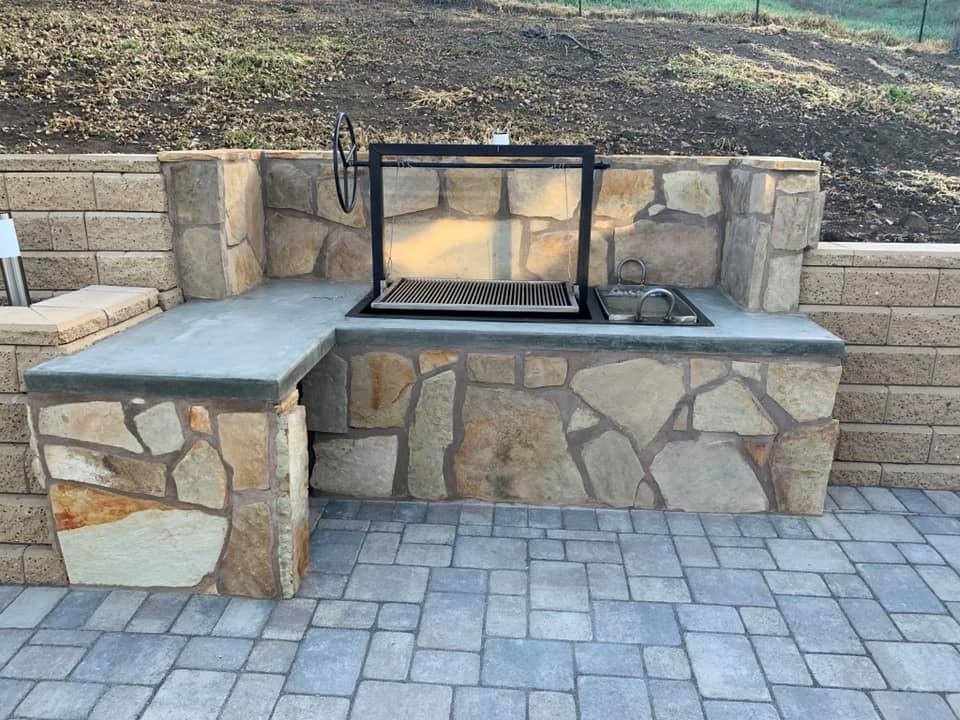 Outdoor kitchen with stone veneer